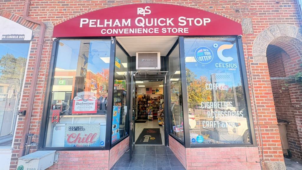 The front of Pelham Quickstop on Lincoln Ave: a red awning reading Pelham Quick Stop Convenience Store above an open entrance, with drinks and snacks visible through the windows.